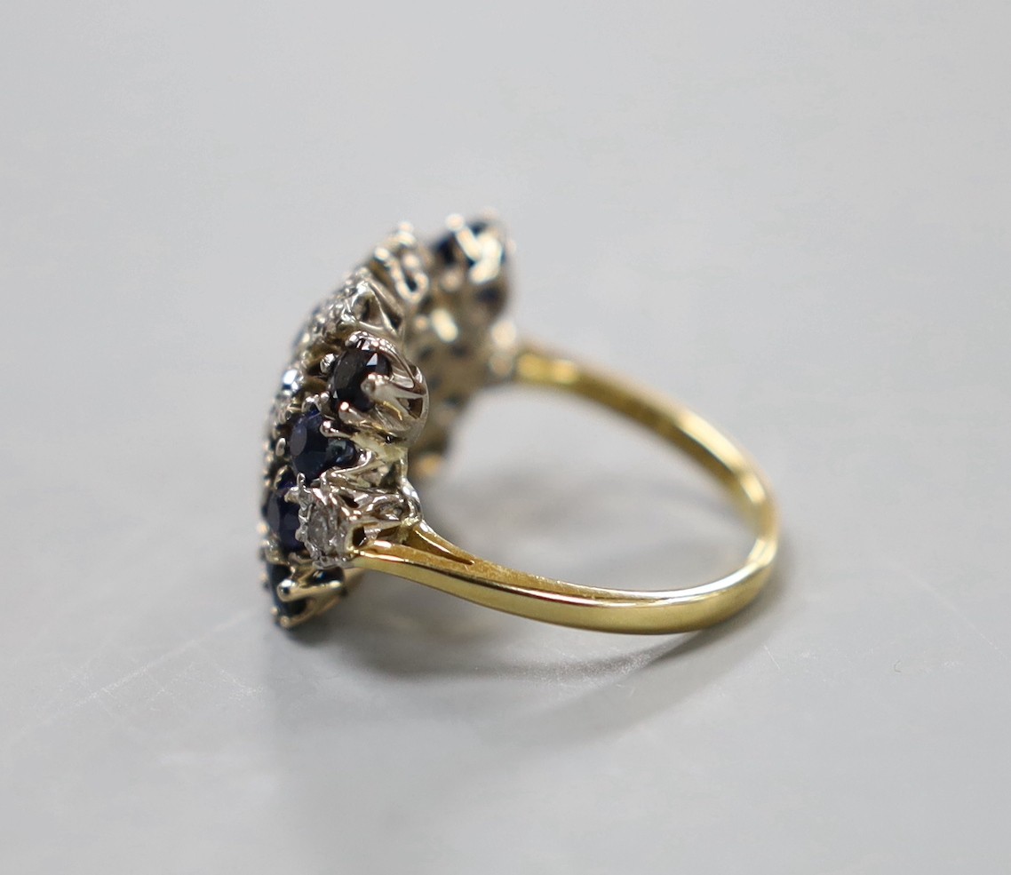 An 18ct, sapphire an diamond set cluster ring, size L/M, gross weight 6.5 grams.